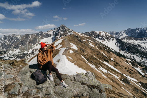  young woman in the mountains. Active rest in one with nature