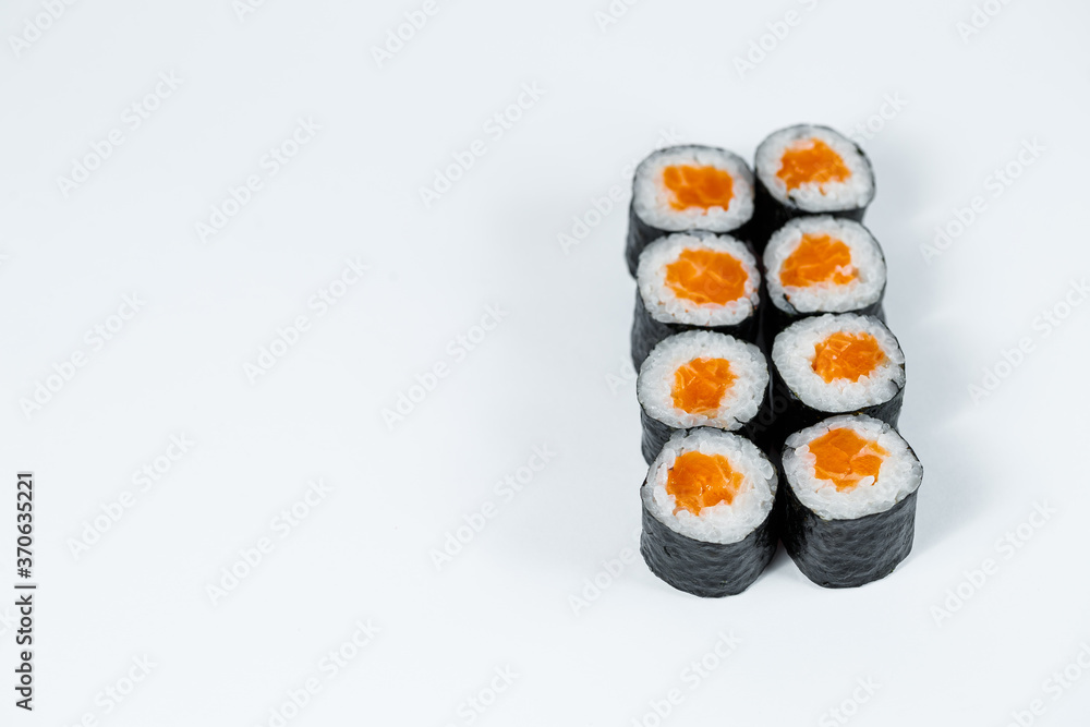 Rolls with red fish, fresh rice with salmon wrapped in nori. Rolls with red fish, fresh rice with salmon wrapped in nori.
