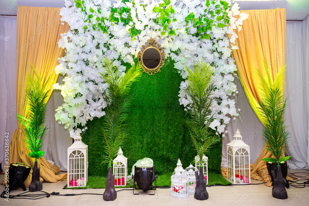 Green artificial grass based wedding stage with artificial colorful ...
