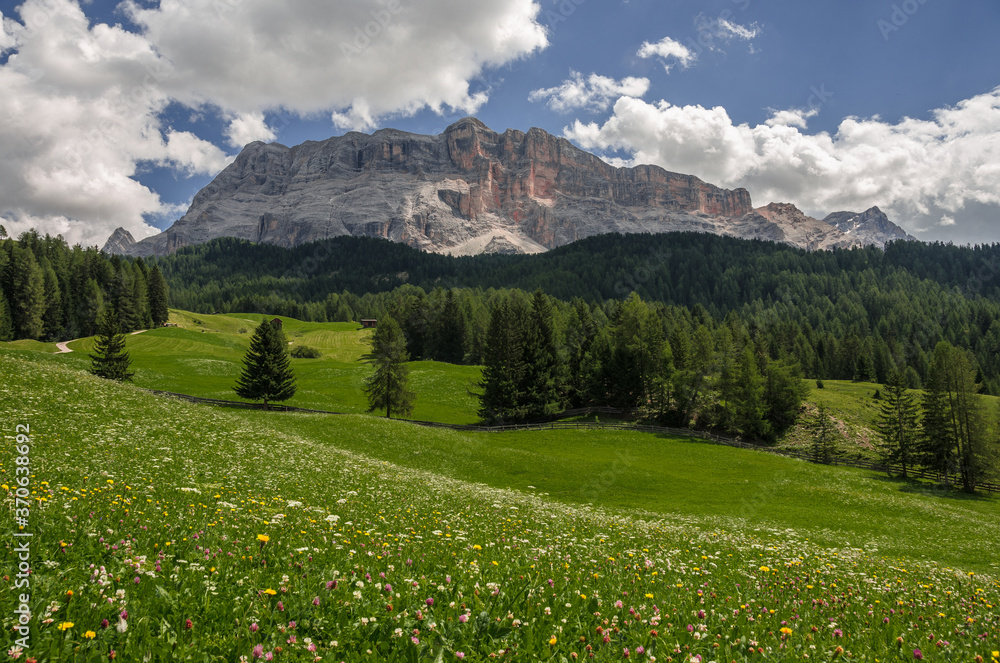 East face of Sasso di Santa Croce mountain range in eastern Dolomites, overlooking Badia valley, the vertical wall of 900 meters & Mount Cavallo, seen from Roda de Armentara, South Tirol, Italy. East face of Sasso di Santa Croce mountain range in eastern Dolomites, overlooking Badia valley, the vertical wall of 900 meters & Mount Cavallo, seen from Roda de Armentara, South Tirol, Italy.