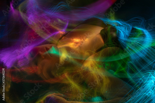 light painting  erotic portrait, light drawing at long exposure, abstract colorful background 
