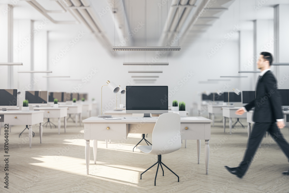 Businessman walking in coworking office room Businessman walking in coworking office room