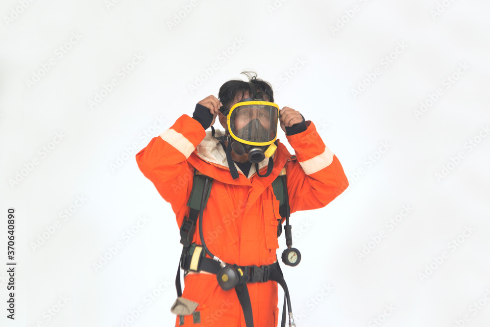 The portrait of Asian firefighters are wearing orange fire protection uniform mask on white background.