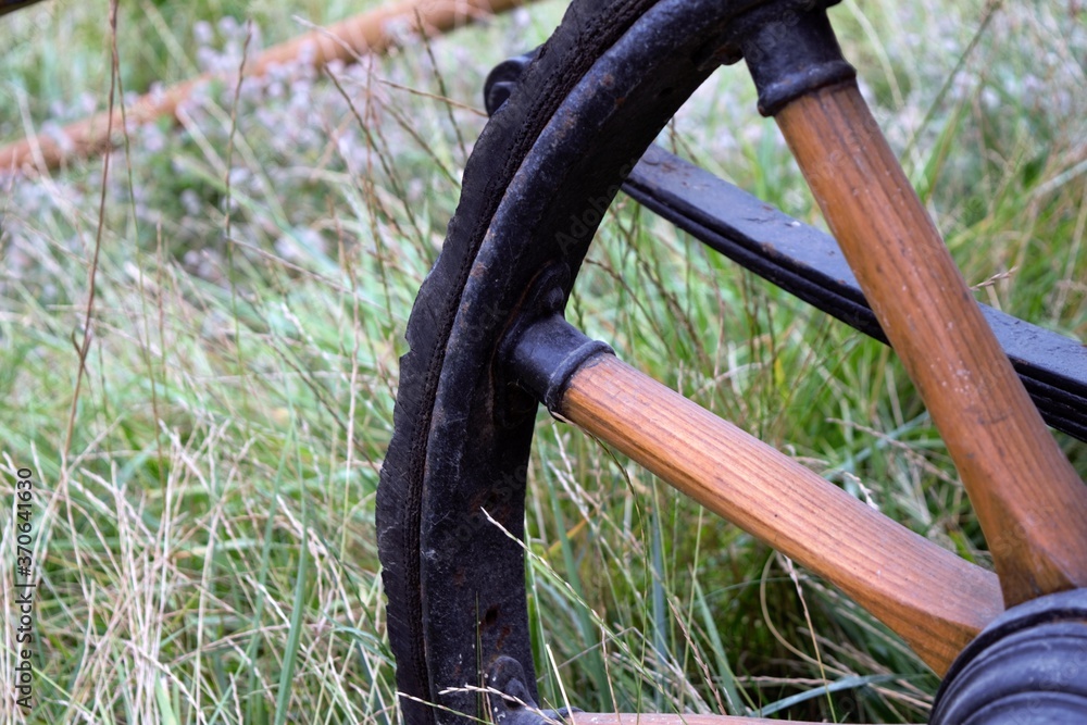 A close-up of the wheel of an old European carriage. A close-up of the wheel of an old European carriage.
