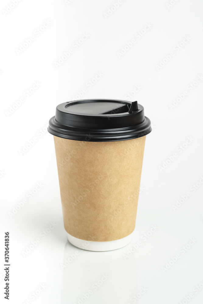 Eco friendly paper craft cup for coffee with black lid on the white background. Zero waste, plastic free concept. Sustainable lifestyle. Front view. Eco friendly paper craft cup for coffee with black lid on the white background. Zero waste, plastic free concept. Sustainable lifestyle. Front view.