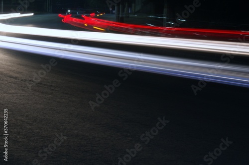 multicolored light traces of cars in blurred motion