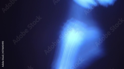 Close up of blue spotlight beam flaring