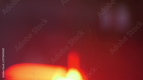Close up of orange spotlight beam flaring