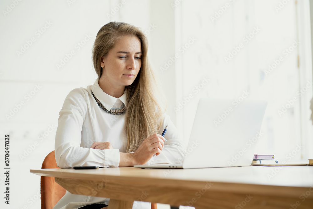 young businesswoman working on laptop young businesswoman working on laptop