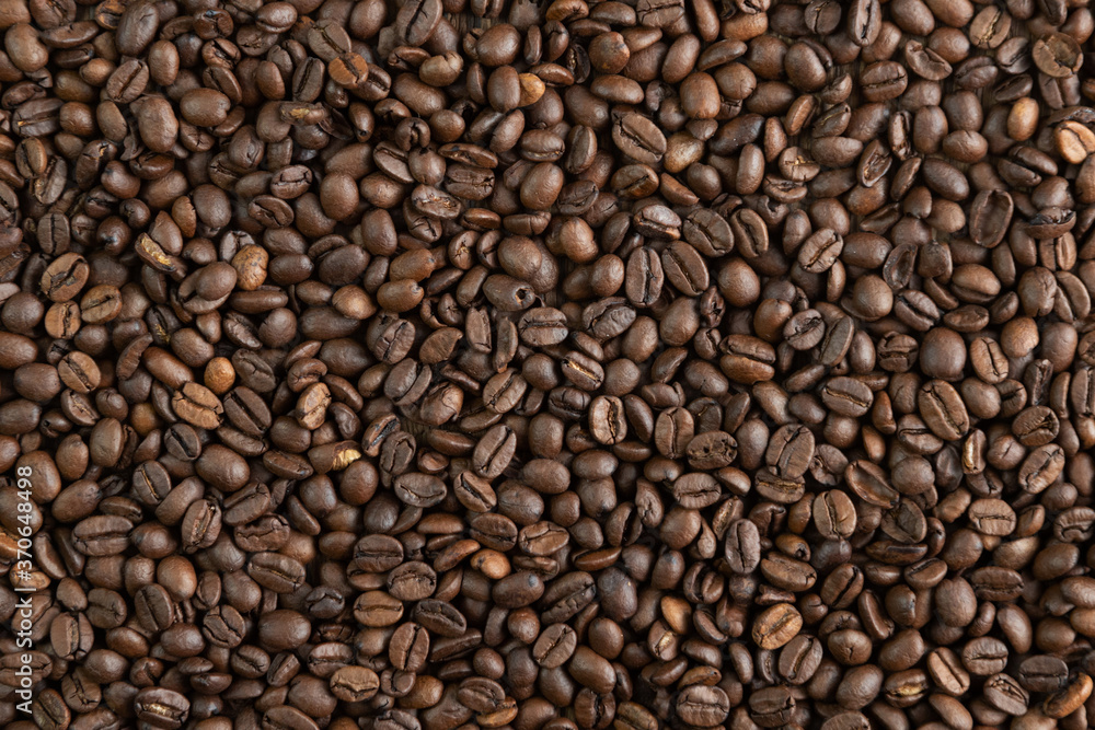 Coffee beans background or texture ideal for advertisements and banners Coffee beans background or texture ideal for advertisements and banners