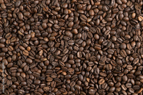 Coffee beans background or texture ideal for advertisements and banners