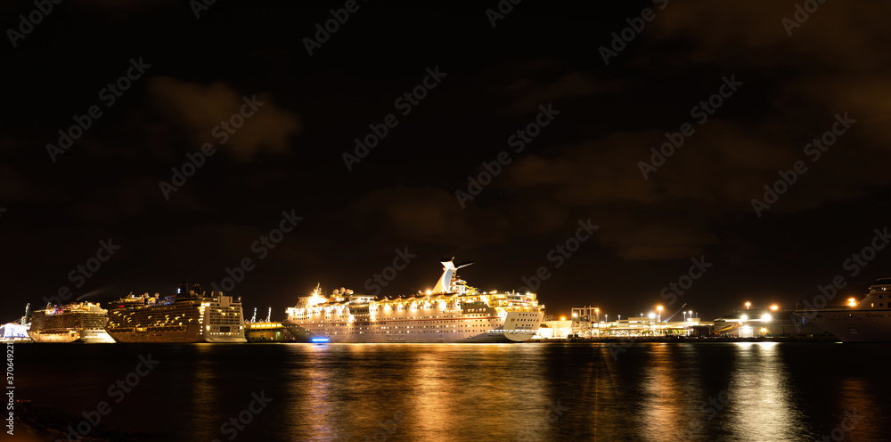 Fototapeta premium Miami, Florida, USA - MAY, 2020: A cruise ship. Night life. Tourism. Traveling on the ocean around the world. Port.