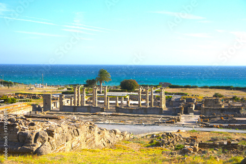 Scenic landscape with ruins of Baelo Claudia is an ancient Roman town on the coast of Spain, Roman city forum, Bolonia, Andalusia, Spain. photo