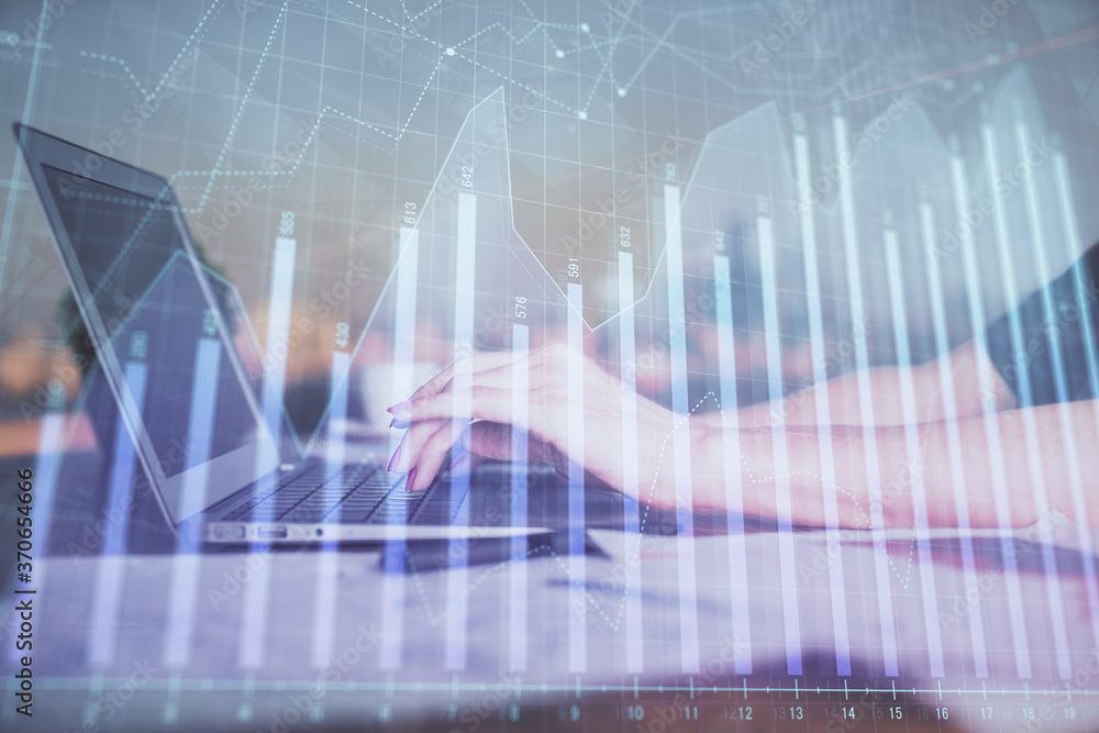 Double exposure of businesswoman hands typing on computer and forex chart hologram drawing. Financial analysis concept. Double exposure of businesswoman hands typing on computer and forex chart hologram drawing. Financial analysis concept.