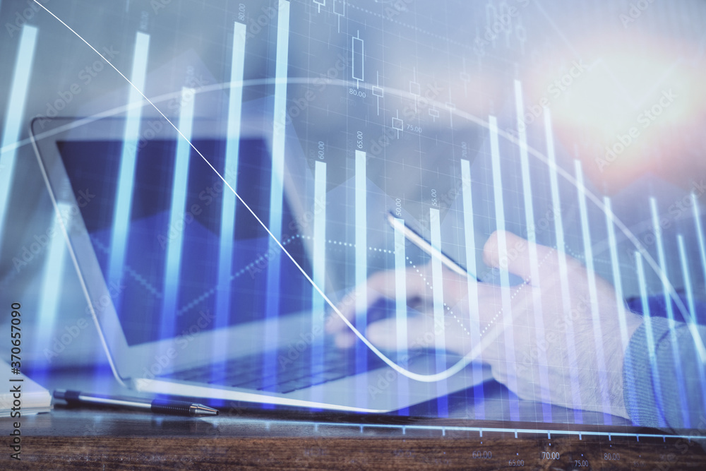 Double exposure of man's hands holding and using a digital device and forex graph drawing. Financial market concept. Double exposure of man's hands holding and using a digital device and forex graph drawing. Financial market concept.