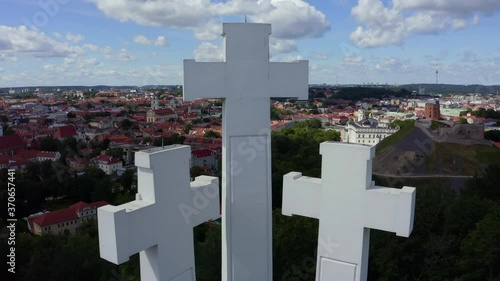 Aerial view of the Three Crosses monument overlooking Vilnius Old Town. Vilnius landscape from the Hill of Three Crosses, located in Kalnai Park, Lithuania. photo