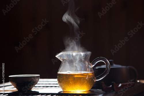 green chinese tea in a glass teapot
