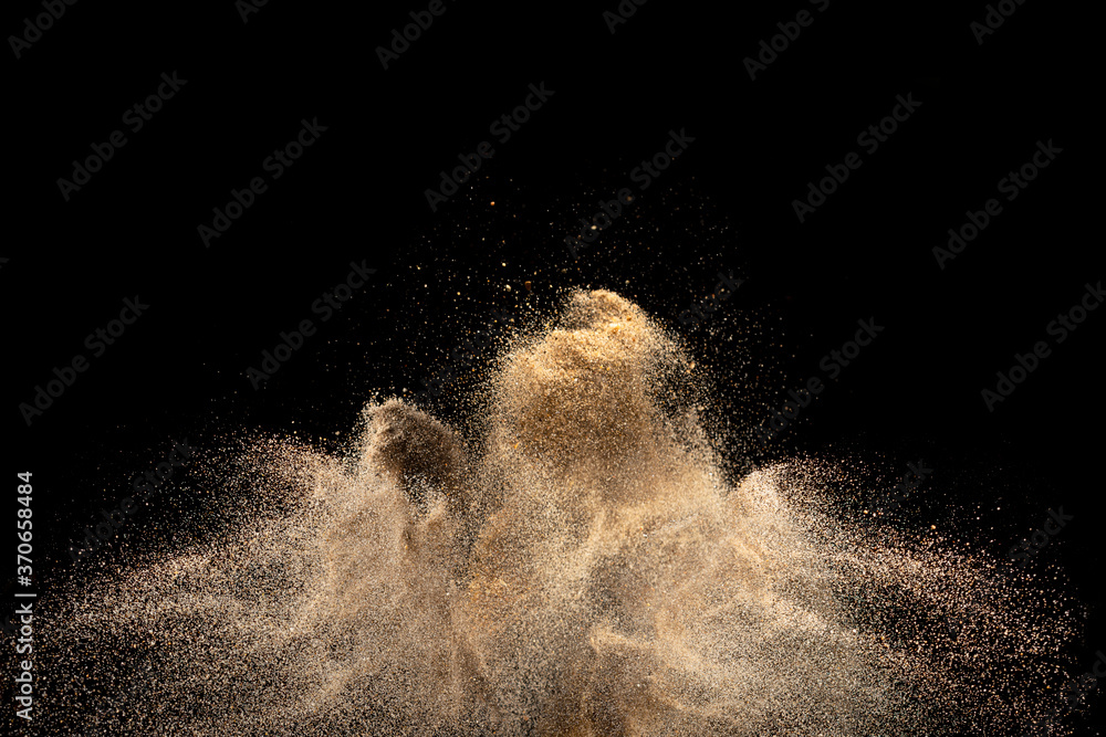 Gold sand explosion isolated on black background.  - obrazy, fototapety, plakaty 