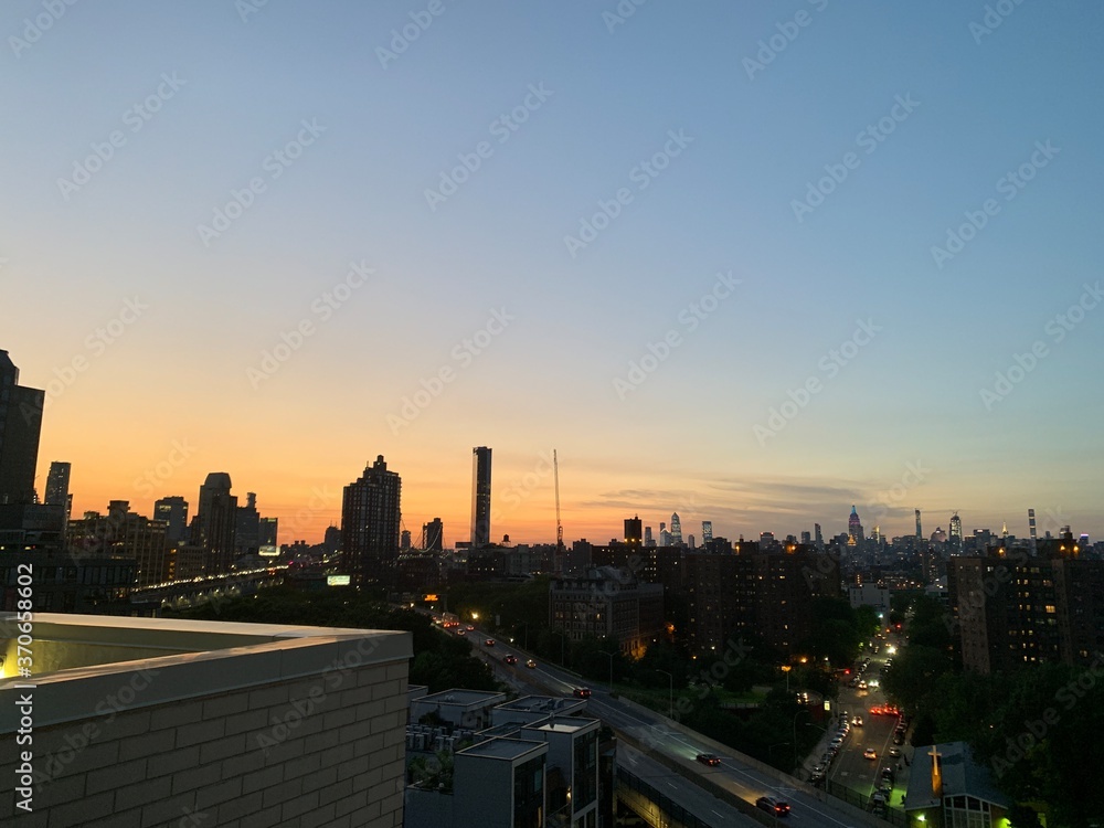 Balcony view of sunset city skyline 