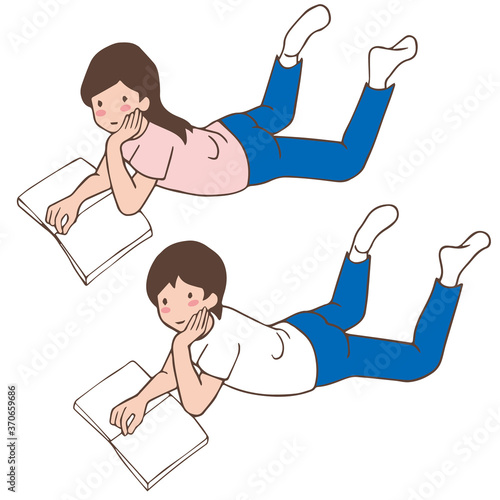 うつ伏せで本を読む子供