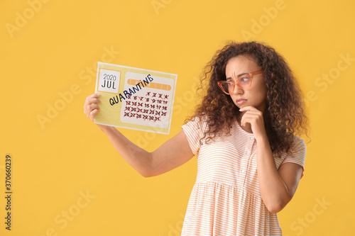 Sad woman holding calendar ...