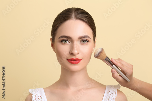 Makeup artist working with ...