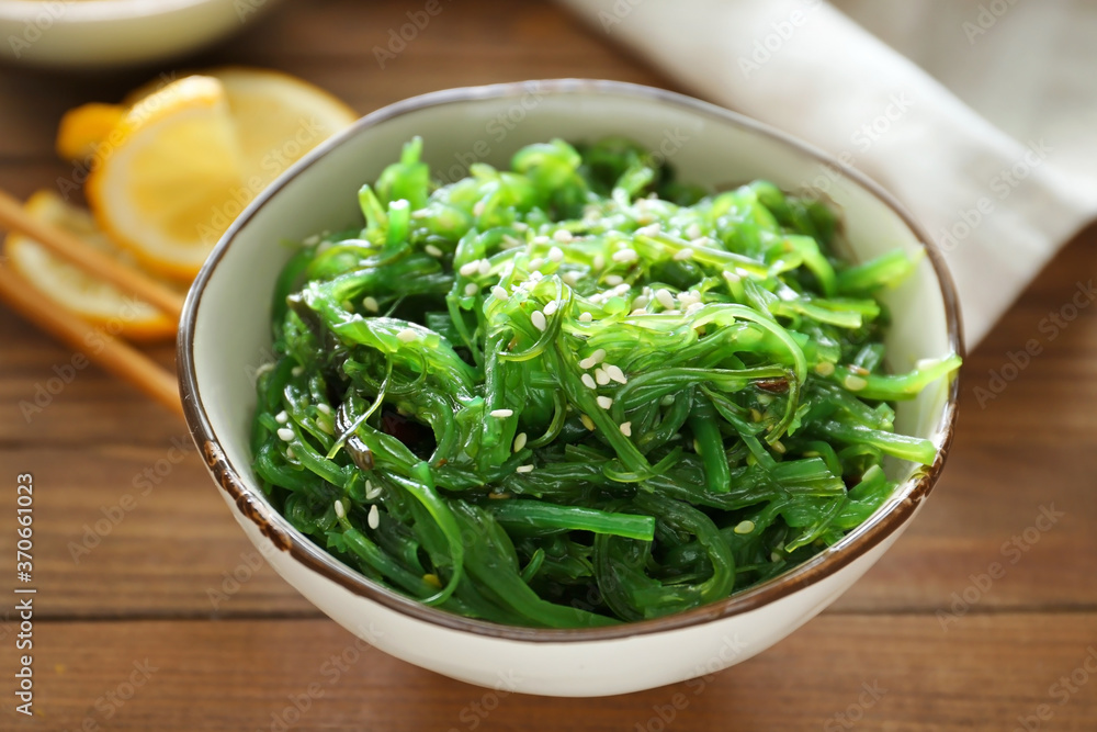 Bowl with tasty seaweed salad on table Bowl with tasty seaweed salad on table