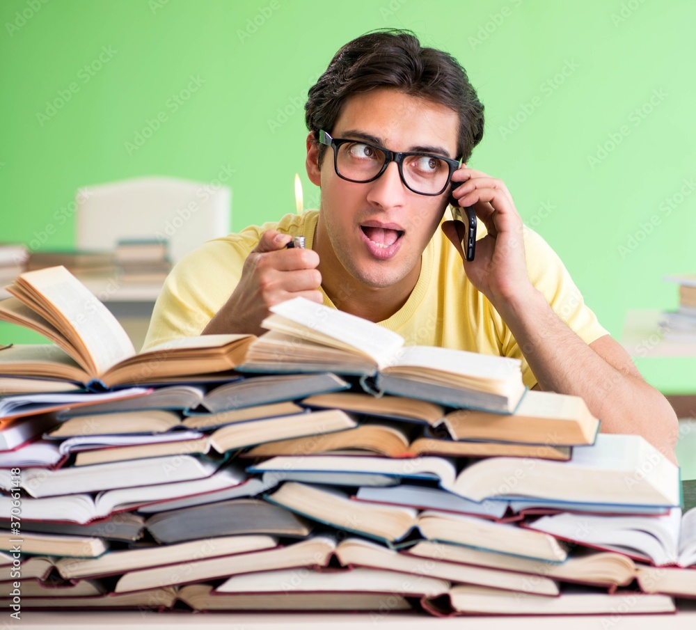 Student with too many books to read before exam Student with too many books to read before exam