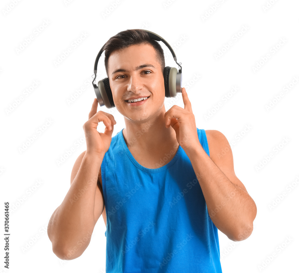 Sporty young man with headphones on white background Sporty young man with headphones on white background