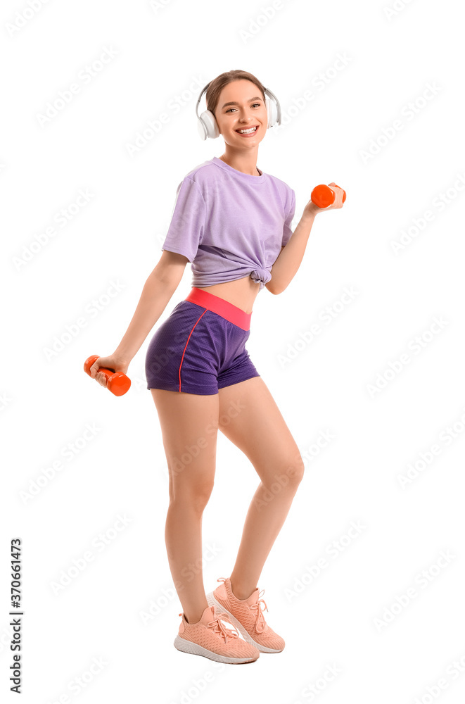 Sporty young woman with headphones and dumbbells on white background Sporty young woman with headphones and dumbbells on white background