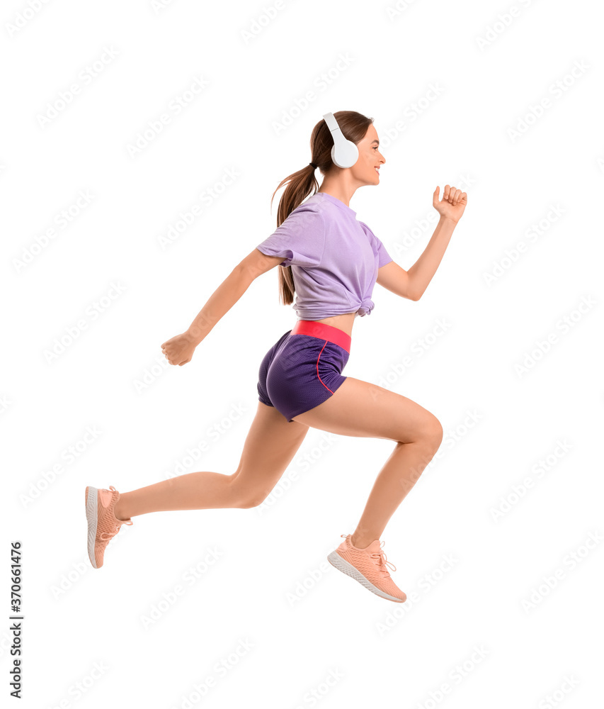 Sporty running young woman with headphones on white background Sporty running young woman with headphones on white background