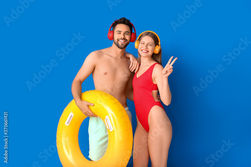 Young couple with headphone...