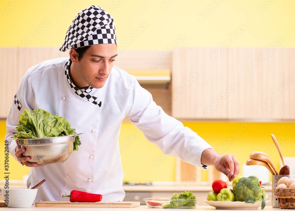 Young professional cook preparing salad at home Young professional cook preparing salad at home