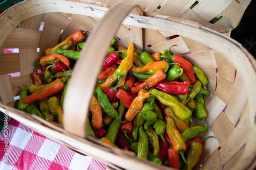 colorful peppers in a basket at farmers market