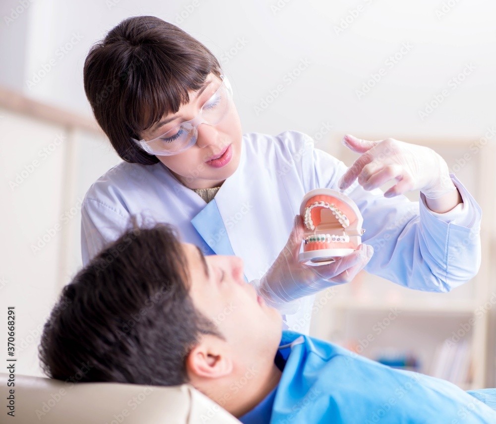 Patient visiting dentist for regular check-up and filling Patient visiting dentist for regular check-up and filling