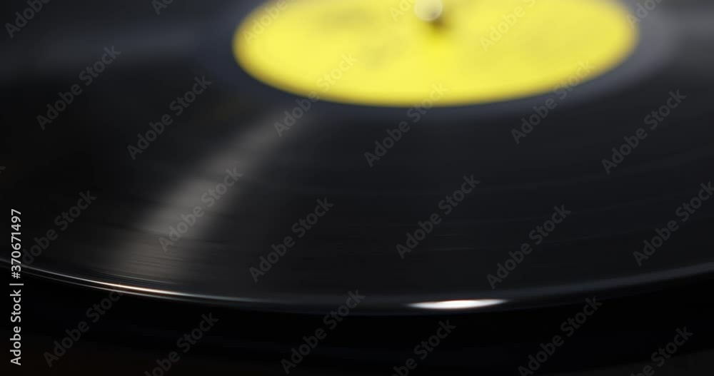 Spinning record with the refection of light on edges Spinning record with the refection of light on edges