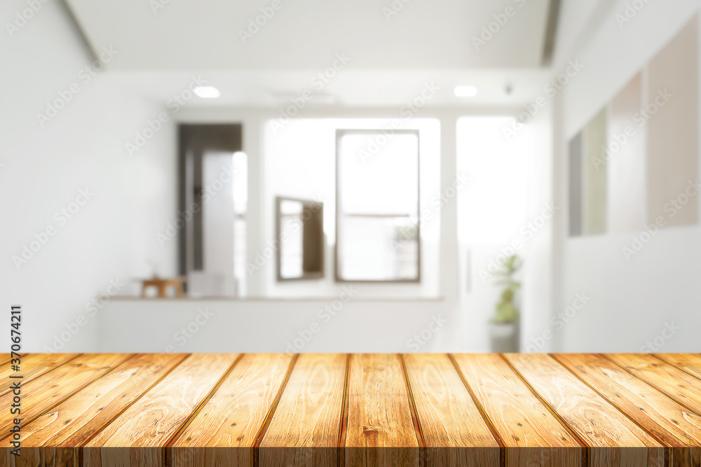 Empty wooden desk space and blurry background of home window for product display montage. Empty wooden desk space and blurry background of home window for product display montage.