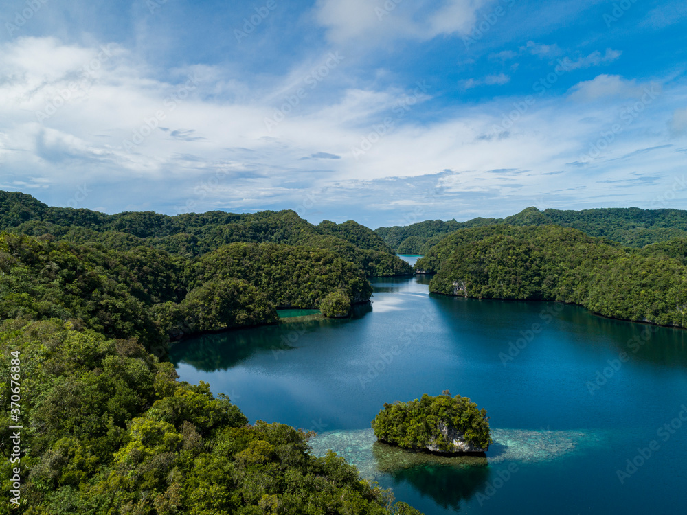 Aerial shot of tropical rock islands in calm tranquil secluded bay in Palau Micronesia