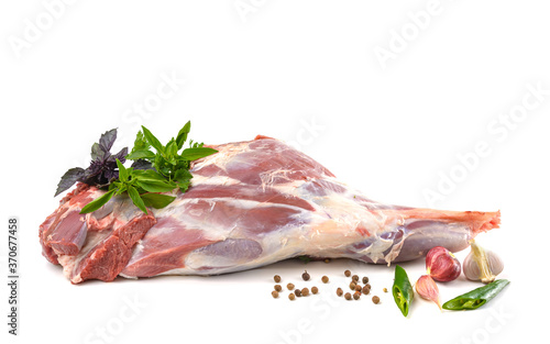 Raw leg of mutton on a bone on a white isolated background. Sheep meat close-up.A fresh piece of mutton. horizontal view. photo