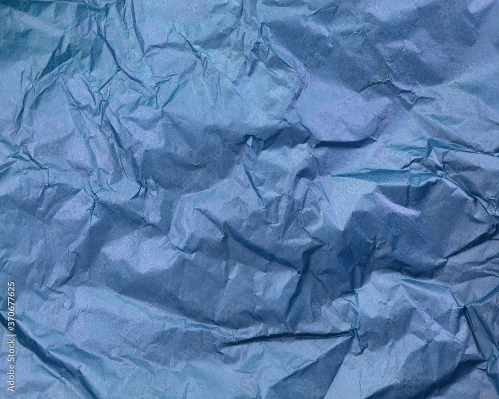 Crumpled blue paper texture background
