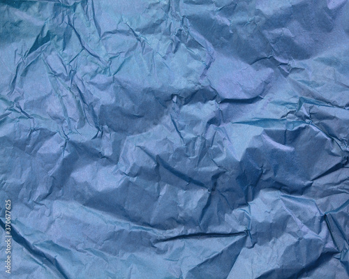 Crumpled blue paper texture background 