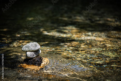 A Rock Tower in a Gentle Stream of a Creek