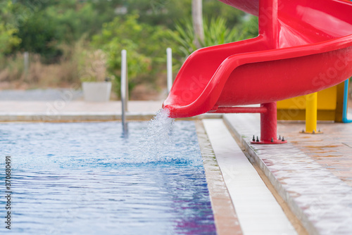 slider ride in swimming pool at water park