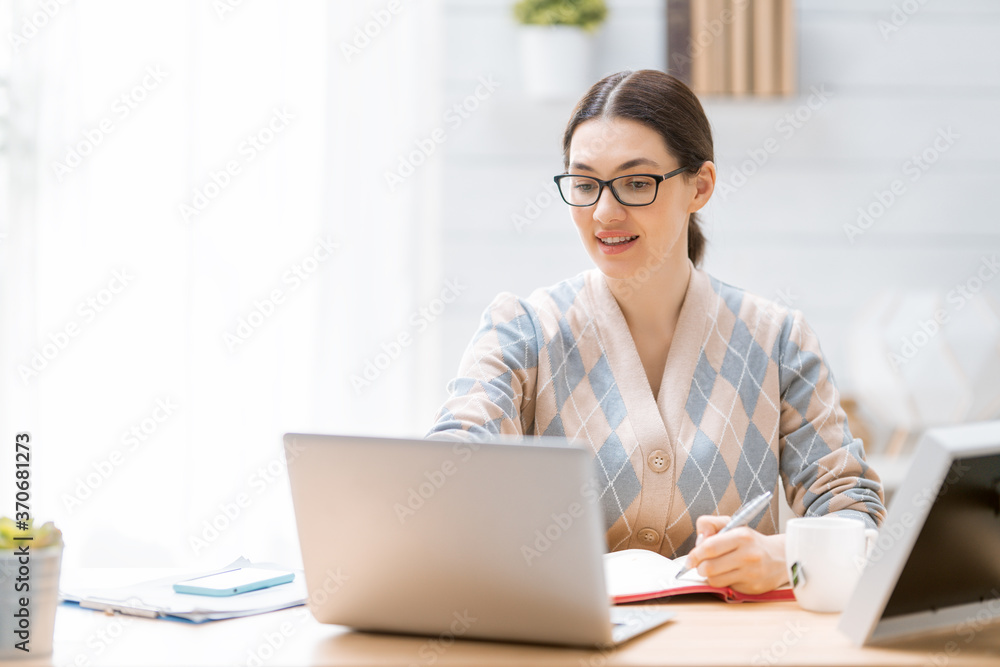 woman working on a laptop at home. woman working on a laptop at home.