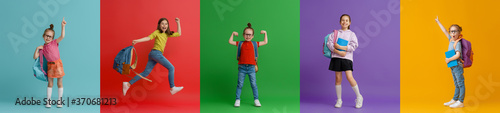 Kids with backpacks on colorful background