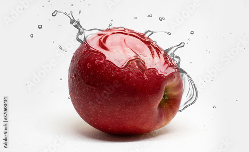 Red apple splash with water / Apple Juice splash / Apple slices splash 
