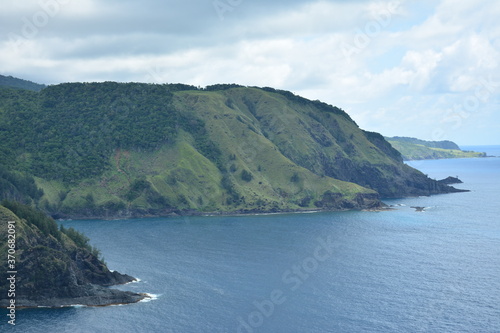 Rock formation and sea water at mountain view white beach resort