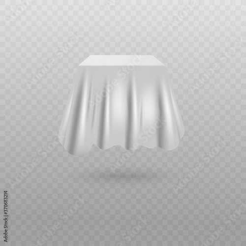 White fabric curtain covering cube shaped hidden object
