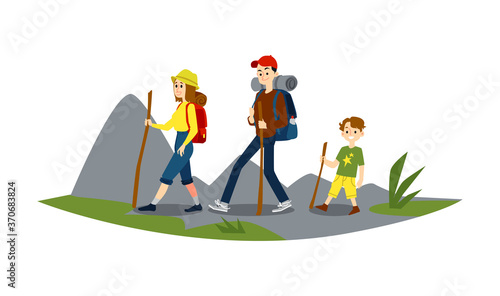 A family of man, woman and boy is engaged in hiking and walking of the mountains.