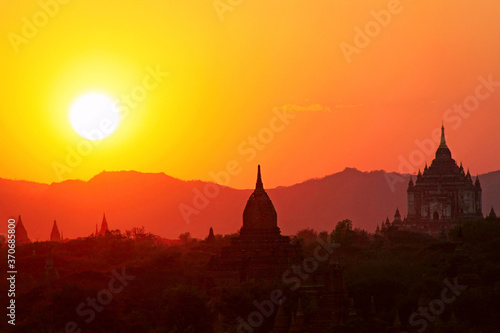 Silhouettes of ancient Buddhist pagodas on the background of sunset sky in Old Bagan  Myanmar